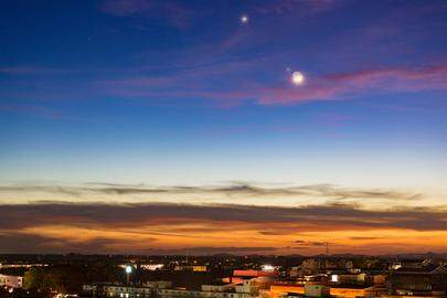 The beautiful twilight sky (Nov 28, 2019) after sunset with the planets conjuction of Moon (with earth shine), Venus and Jupiter.