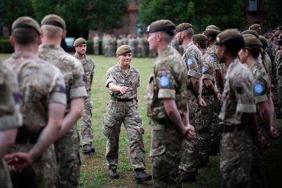 Members of the Coldstream Guards during a ceremony at Victoria Barracks, Berkshire, as they swap their green berets with a United Nations' beret. The change of headgear is the final step in the dual role of the soldiers' training and preparation prior to being deployed on peacekeeping duties in Cyprus. They will be the latest force to take up the role on Operation Tosca, the longest ongoing military operation in history. Operation Tosca is an unaccompanied six-month UN tour of duty and the soldiers are responsible for maintaining the integrity of the Buffer Zone that runs between the Greek and Turkish Cypriots including the capital Nicosia, which is the last city in the world to be divided by a demilitarised zone. Picture date: Thursday July 31, 2025. (Photo by James Manning/PA Images via Getty Images)