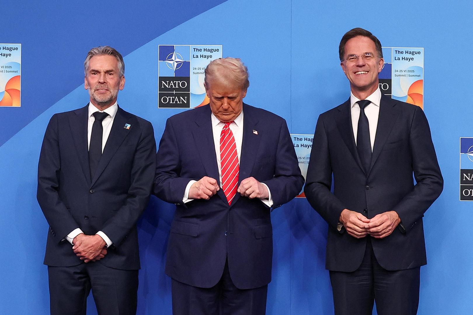 Dutch Prime Minister Dick Schoof, U.S. President Donald Trump and NATO Secretary General Mark Rutte pose for a photo during a NATO summit in The Hague, Netherlands June 25, 2025. REUTERS/Yves Herman
