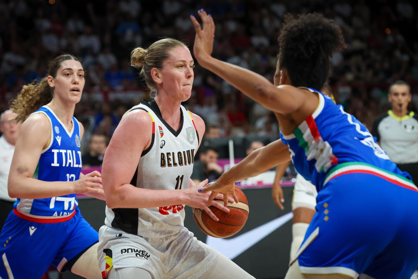 Italian Valerie De Pretto and Belgium's Emma Meesseman fight for the ball during a basketball match between Belgian national team 'the Belgian Cats' and Italy, in the semi-finals of the FIBA Women's EuroBasket tournament, Friday 27 June 2025 in Piraeus, Greece. BELGA PHOTO VIRGINIE LEFOUR