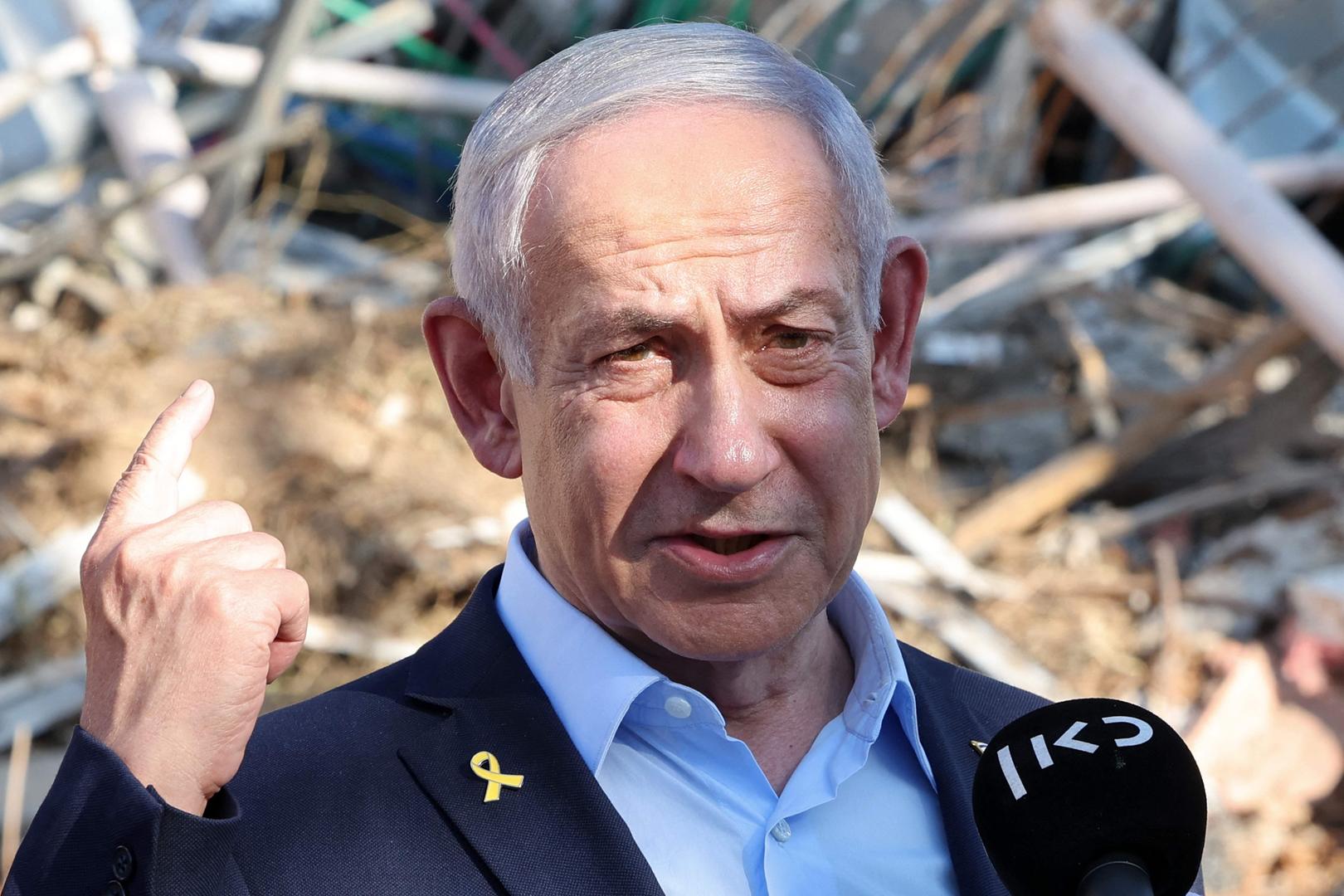 TOPSHOT - Israel's Prime Minister Benjamin Netanyahu gives a statement during a visit to the site of the Weizmann Institute of Science, which was hit by an Iranian missile barrage, in the central city of Rehovot on June 20, 2025. (Photo by Jack GUEZ / POOL / AFP)